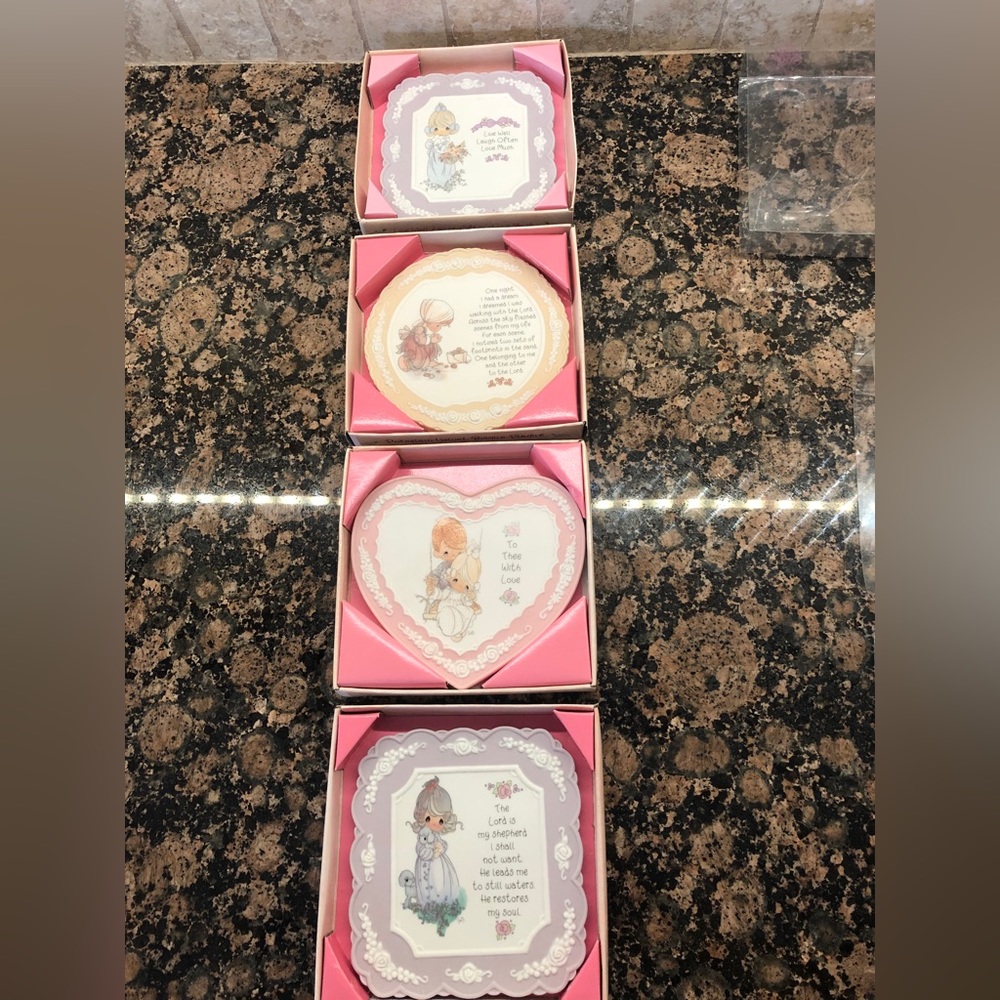 Precious moments.  Porcelain plaques.  Set of 4.  Never been used. Still boxed